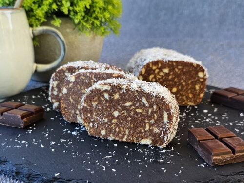 Biscuit Salami slices served on a plate with tea