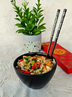 Chinese Pork with Vegetables stir-fry served in a wok with vibrant fresh veggies and a side of jasmine rice.