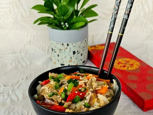 Chinese Pork with Vegetables stir-fry served in a wok with vibrant fresh veggies and a side of jasmine rice.