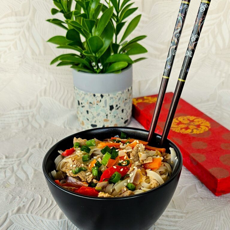 Chinese Pork with Vegetables stir-fry served in a wok with vibrant fresh veggies and a side of jasmine rice.