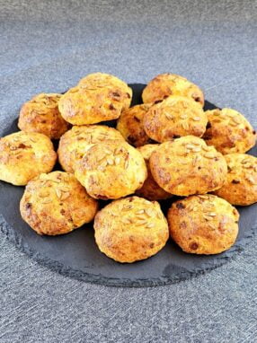 Plate of Bacon Biscuits with melted cheese and bacon bits