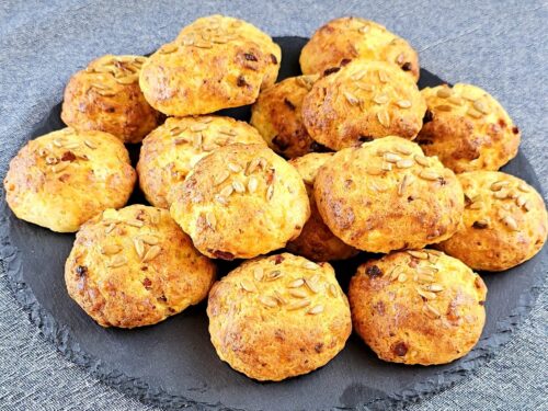 Plate of Bacon Biscuits with melted cheese and bacon bits