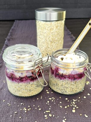 A bowl of creamy Blueberry Porridge topped with fresh blueberries and chia seeds